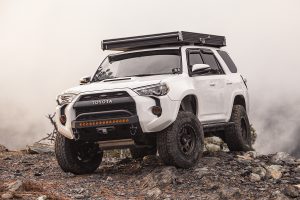 White Lifted 4Runner with Rooftop Tent & Fiberglass Fenders