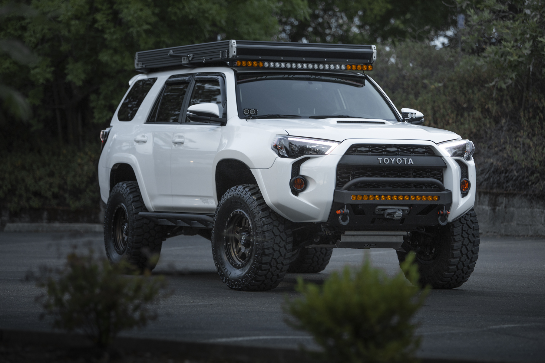 Toyota 4Runner with Go Fast Camper RTT and Lo Pro Bumper (White on Bronze)