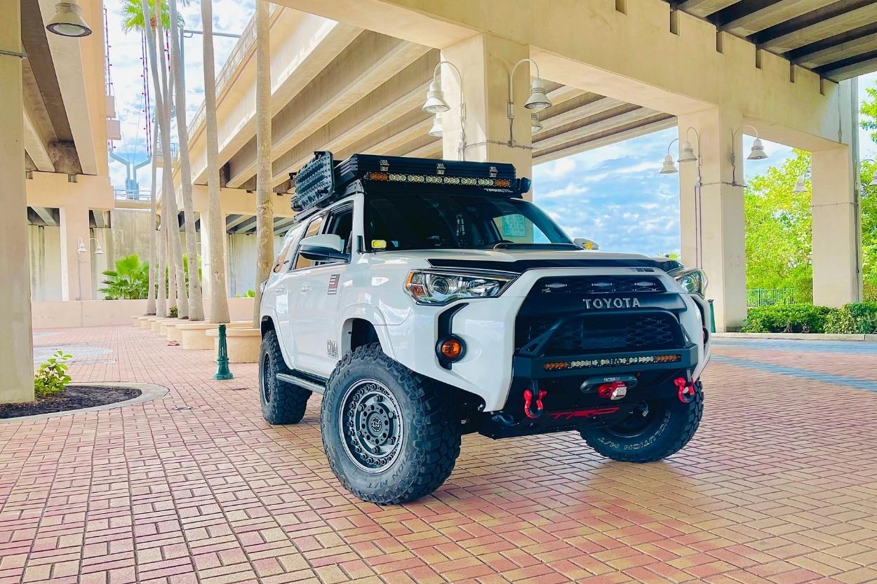 white 4runner trd pro with C4 Fab LoPro Front Bumper RiGd Supply Ultraswing Area BFE RTT & AWNING Black Rhino Armory Wheels w/ Cooper EVO MT’s 33”