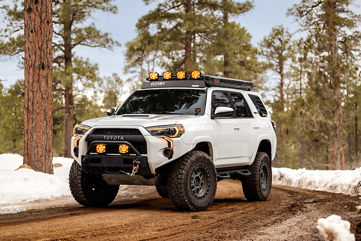 Lifted White 5th Gen TRD Pro 4Runner With Black Black Rhino Kelso Wheels & Gobi Roof Rack With ARB Awning