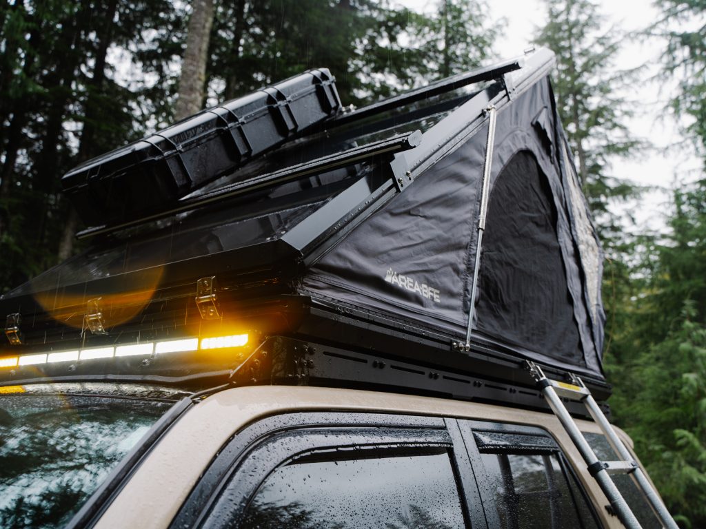 AreaBFE Rooftop Wedge Tent Mounted on Prinsu Rack With Pelican 1745 Long Storage Case 